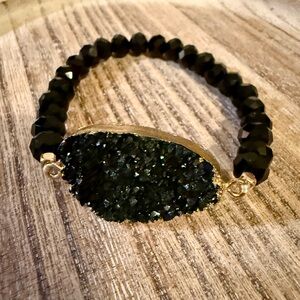 Unique Black Beaded Bracelet with Gold Accents